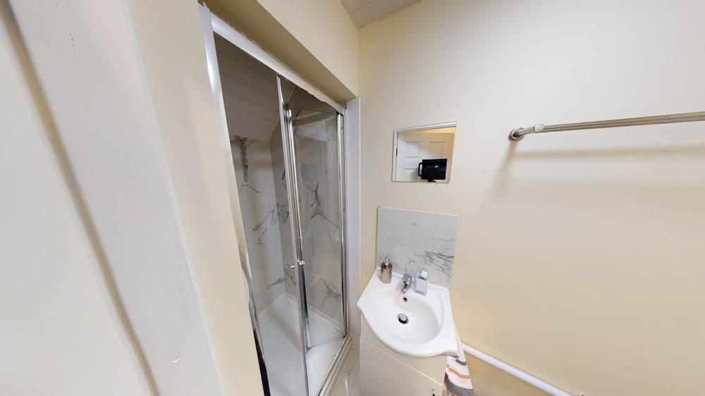 A clean and well-maintained bathroom featuring ...