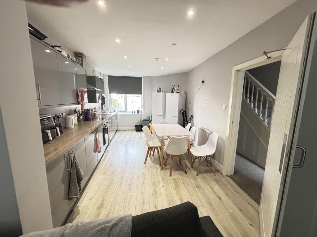 A spacious and modern living room filled with n...