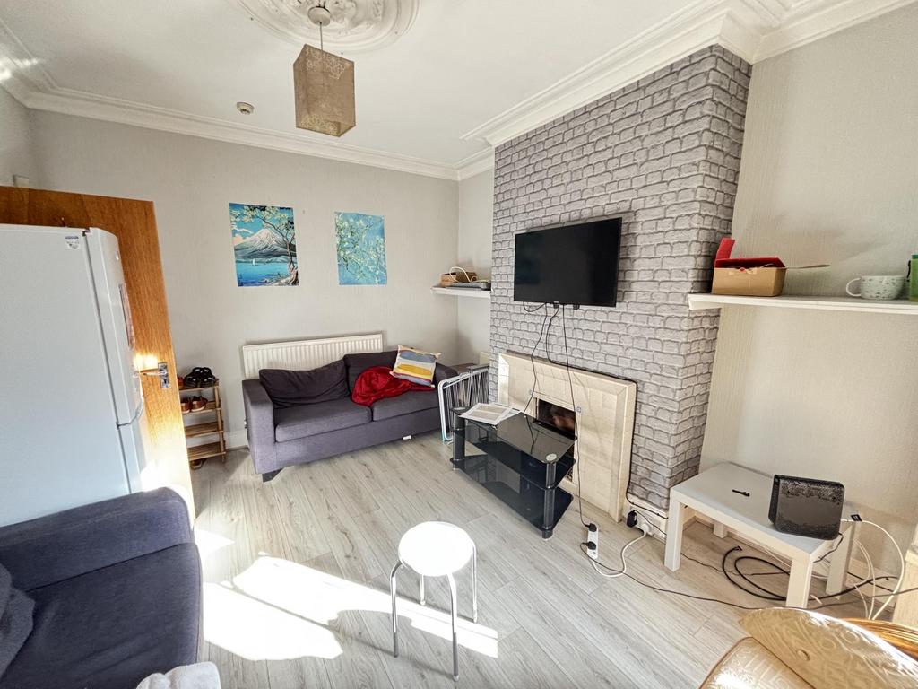 Bright and welcoming living room featuring mode...