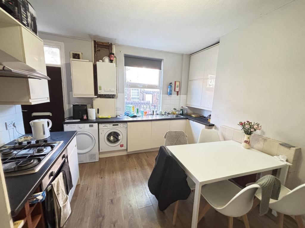 A bright, modern living room featuring a cozy a...