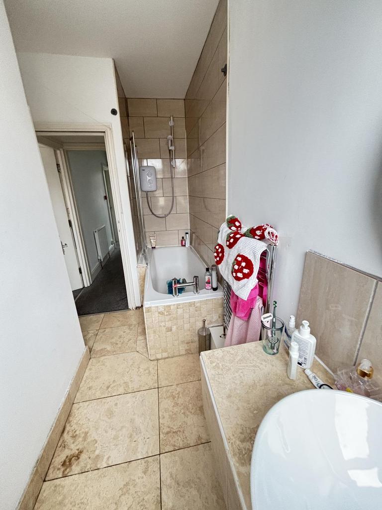 A clean and well-maintained bathroom featuring ...
