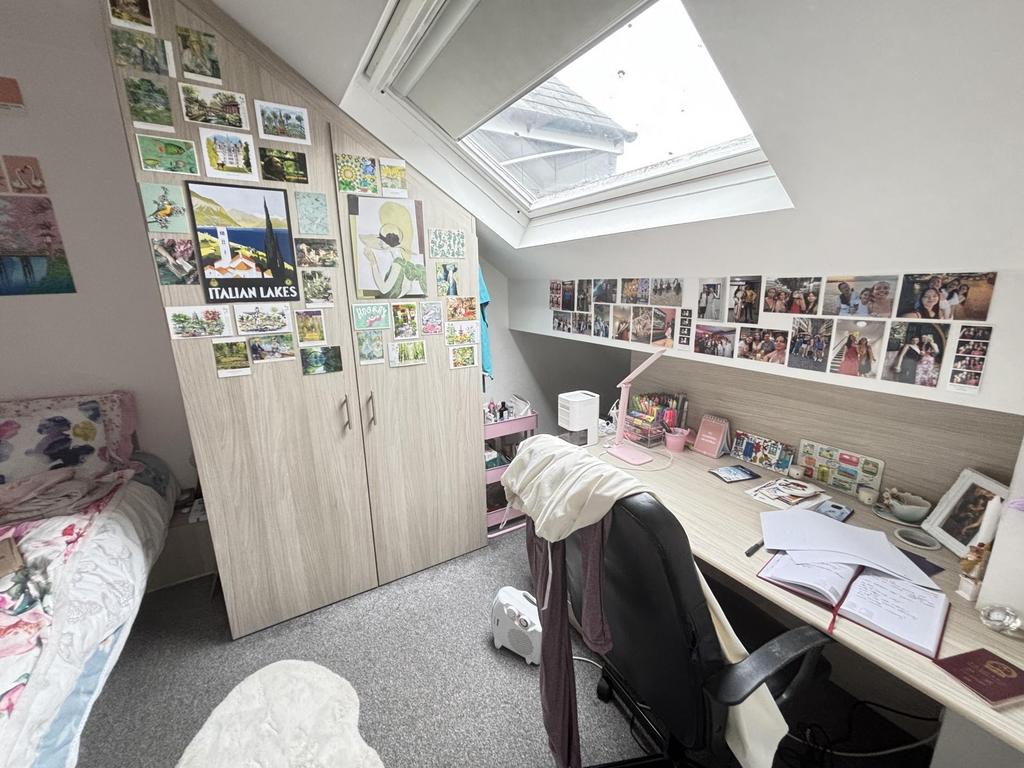 A compact, clean single toilet room with suffic...