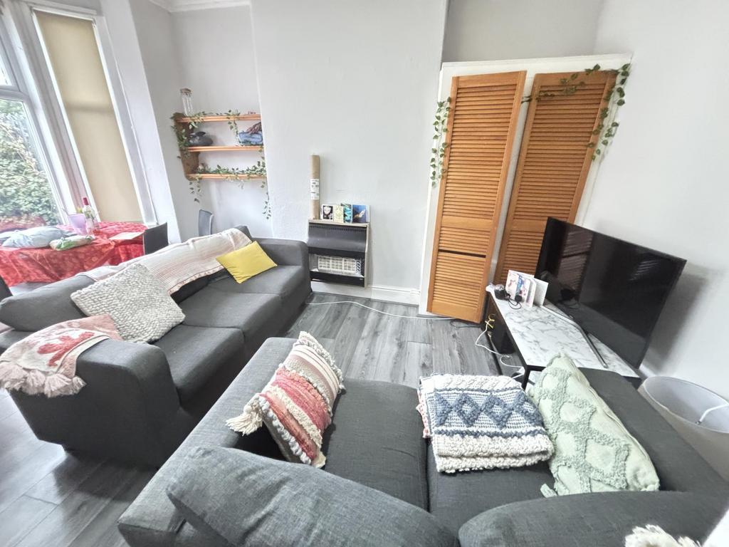 A bright and spacious living room featuring a l...