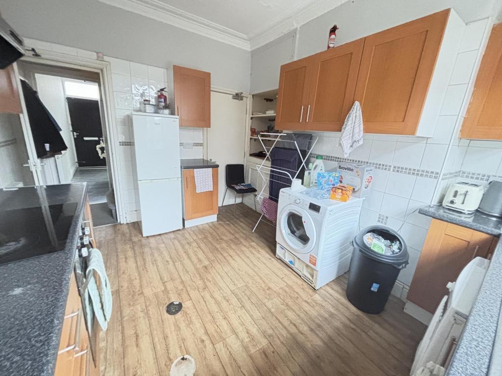 A functional kitchen area featuring essential a...