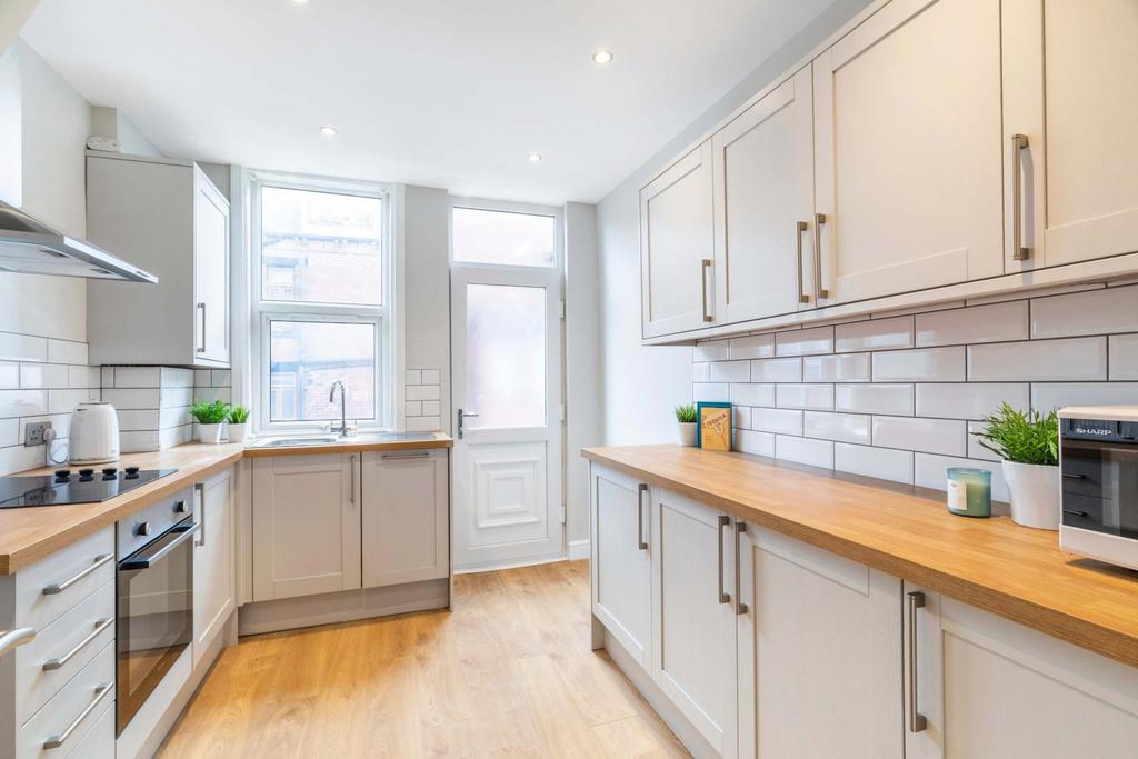 Bright and modern kitchen with ample natural li...