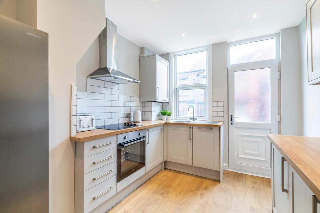 Bright and modern kitchen with ample natural li...