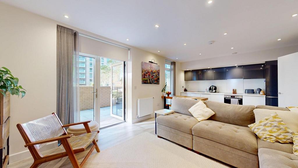 Bright and spacious living room with large wind...