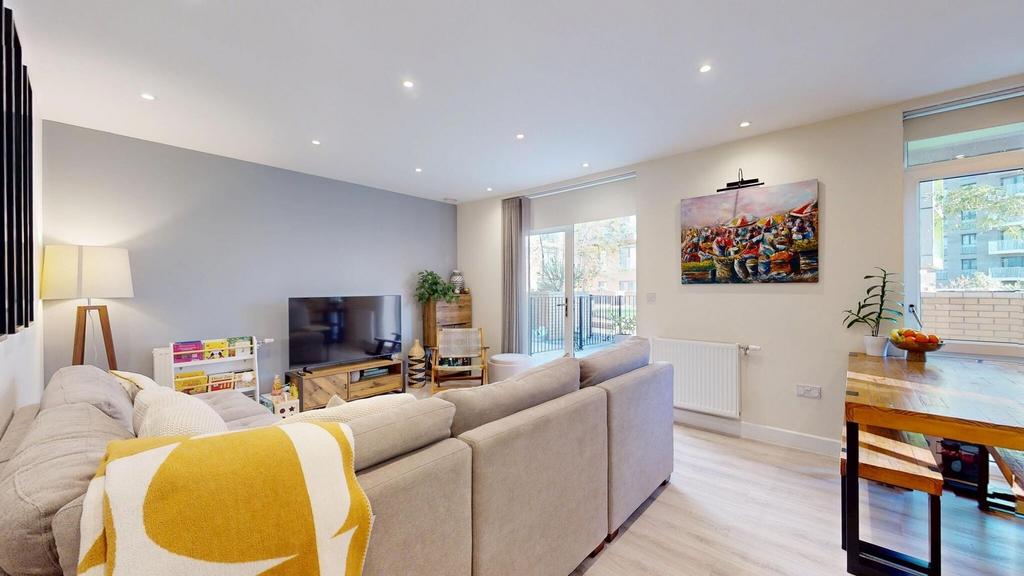 Bright and spacious living room with large wind...