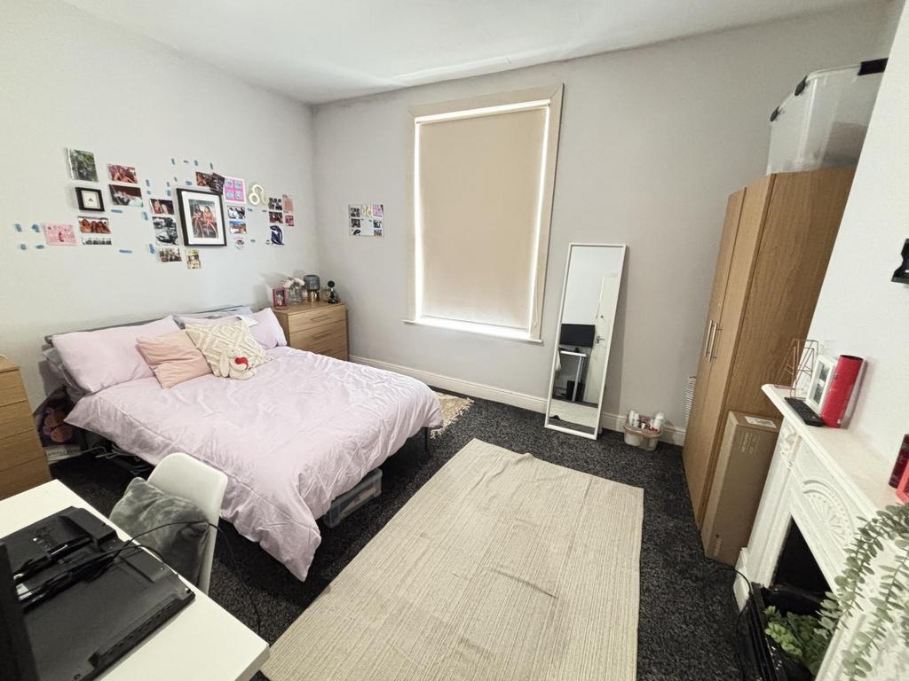 A bright and spacious master bedroom featuring ...