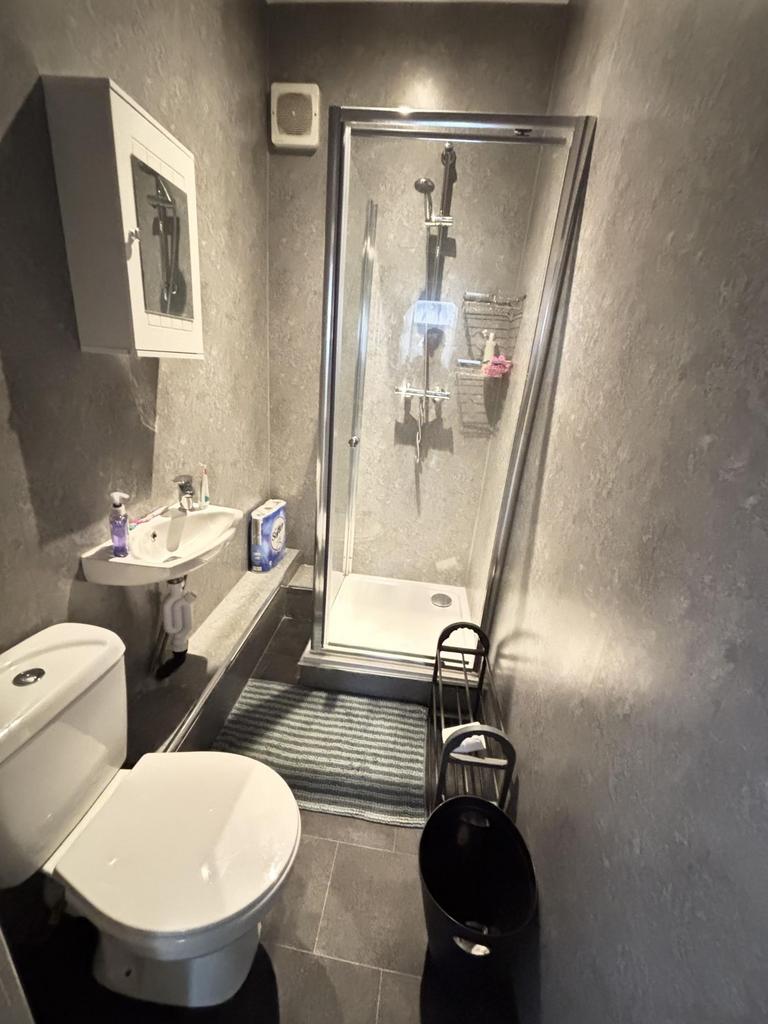 A clean and functional bathroom featuring a toi...