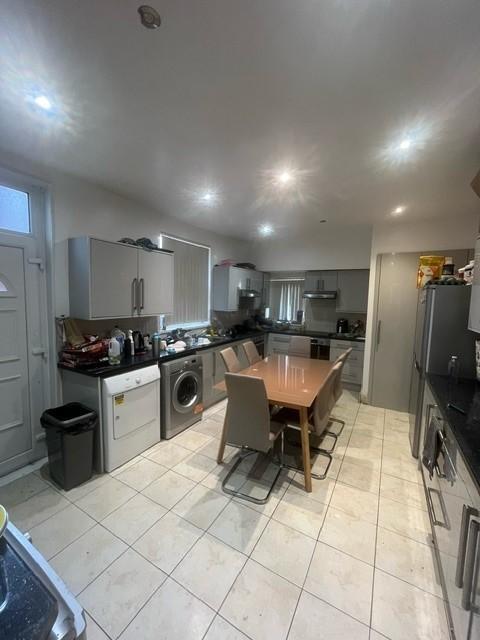 Bright and functional kitchen with ample worksp...