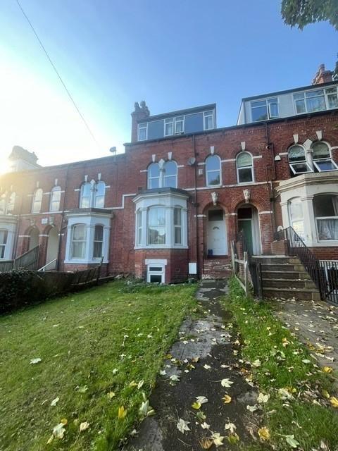 A classic brick-fronted residential building wi...