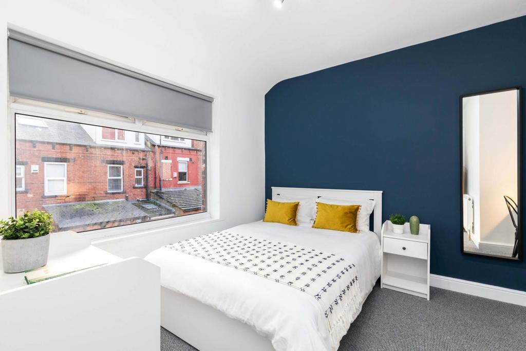 Bright and inviting master bedroom featuring a ...