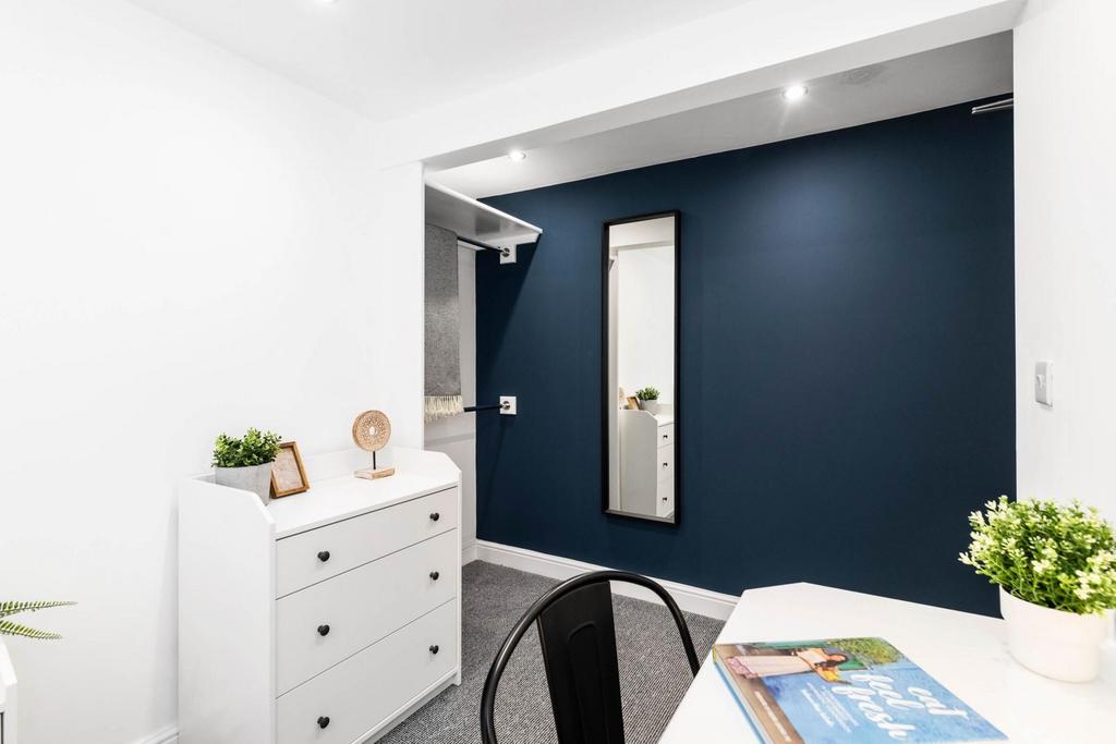 A modern and well-lit living room with a minima...