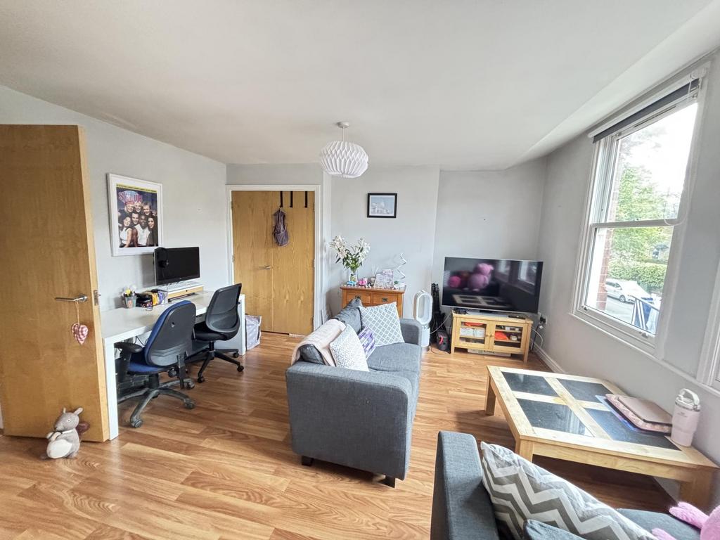 A bright and inviting living room with ample na...