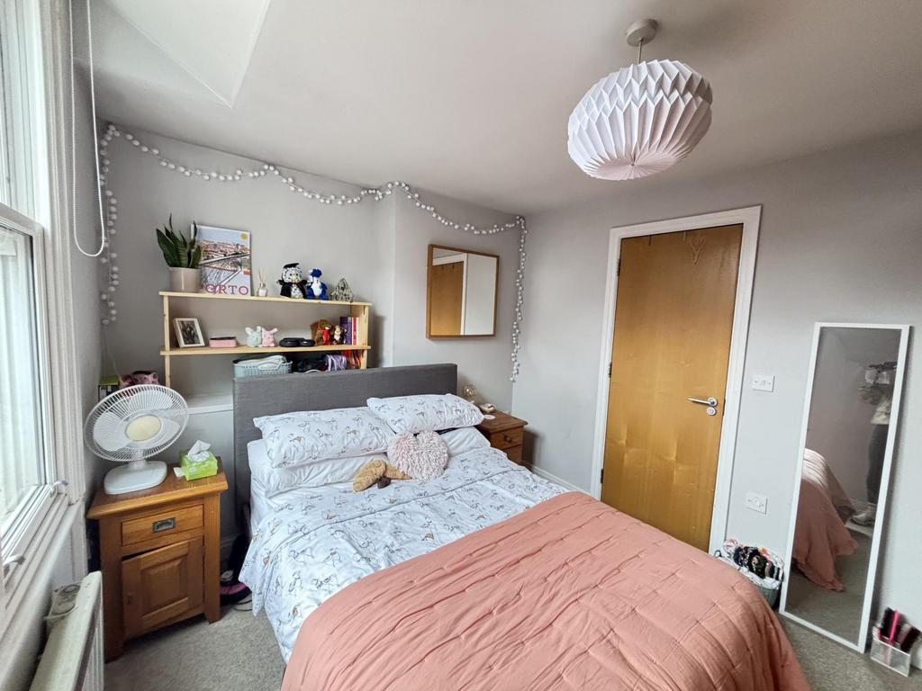 A warm and inviting bedroom featuring a large d...