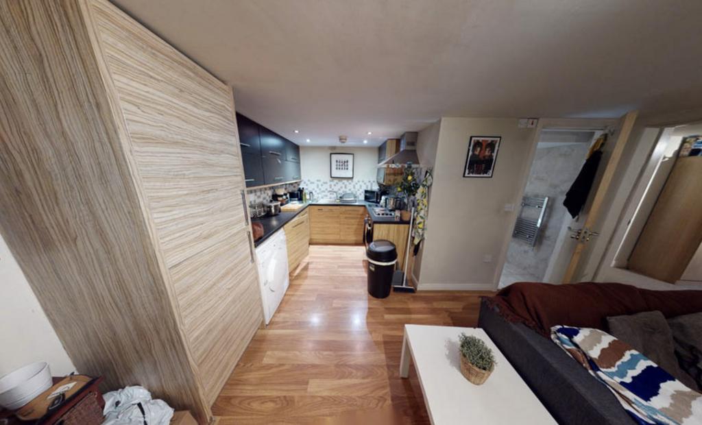 A spacious and well-lit contemporary living roo...