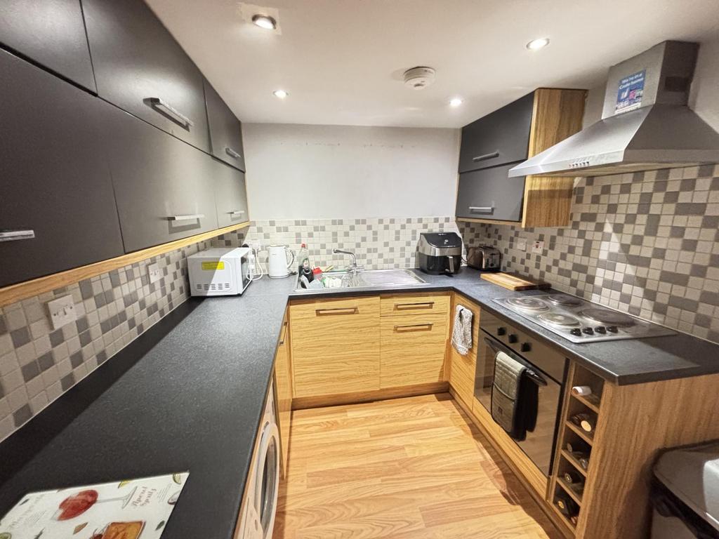 Bright and modern kitchen with ample workspace,...