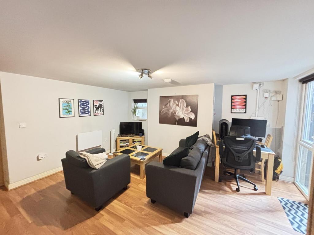 A modern, well-lit living room with comfortable...