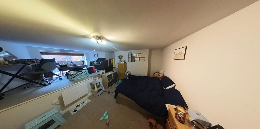 A spacious and well-lit living room with ample ...