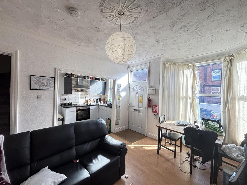 Bright and welcoming living room featuring comf...