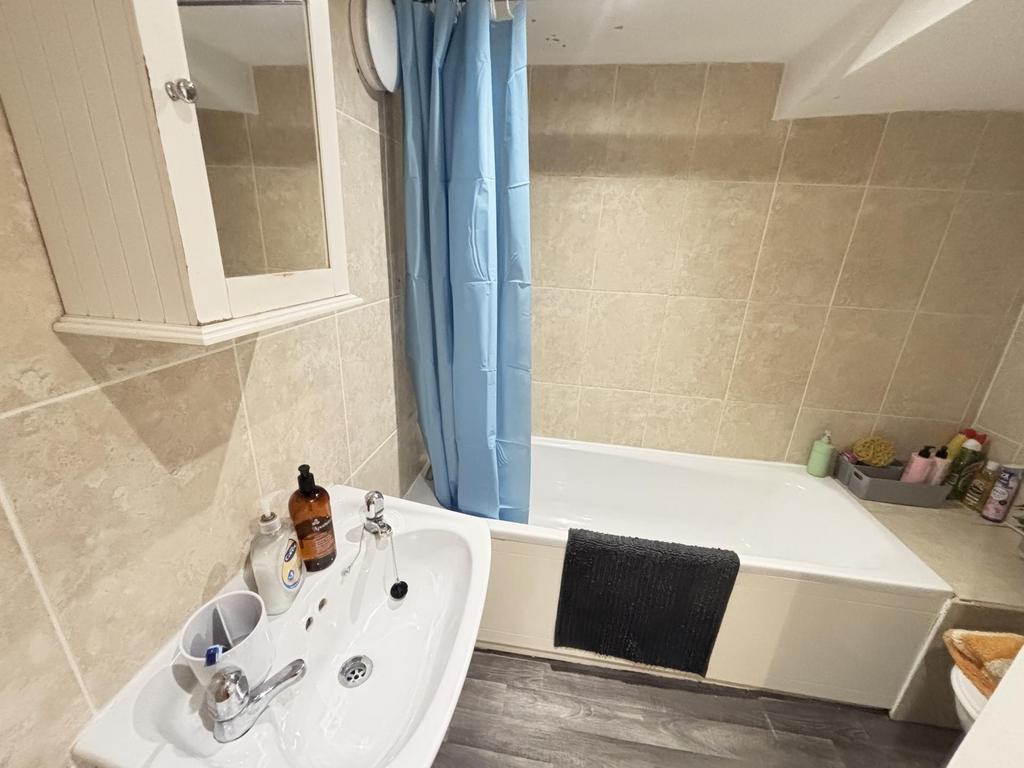 Bright and clean modern bathroom featuring a la...