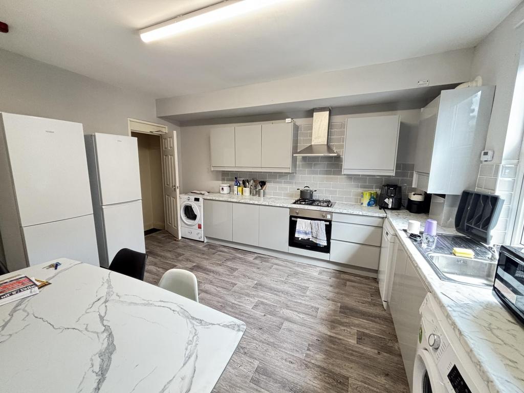Bright and modern kitchen with ample natural li...