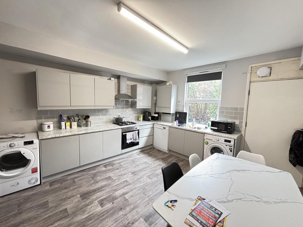 Bright and modern kitchen with ample counter sp...