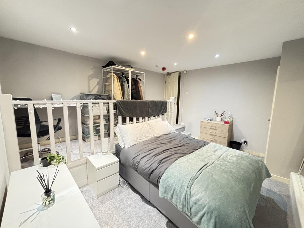 Bright and spacious double bedroom featuring a ...