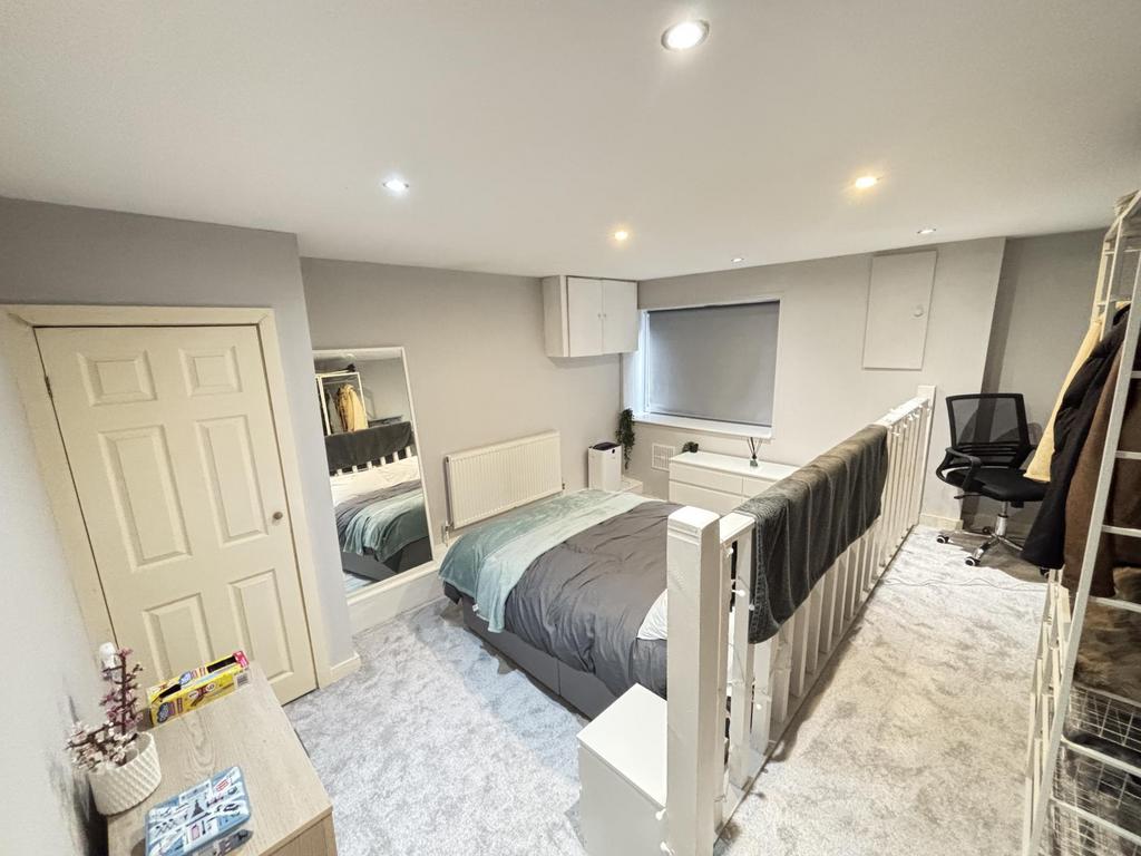 Bright and inviting bedroom featuring a comfort...