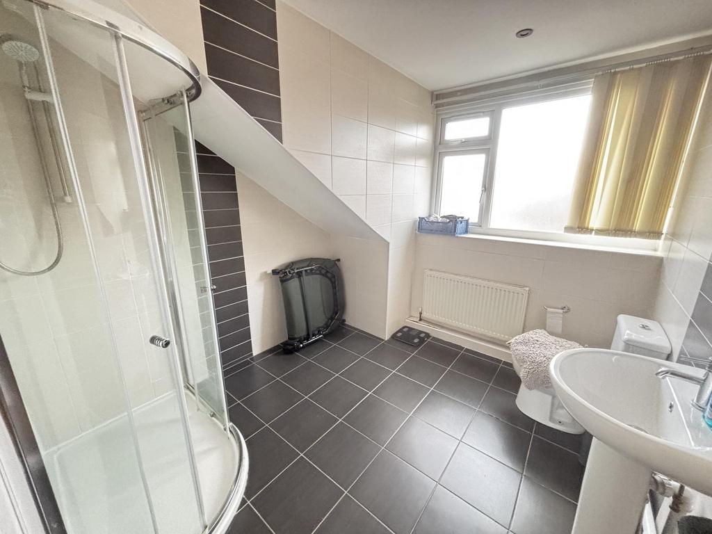 Bright and spacious bathroom with a large windo...