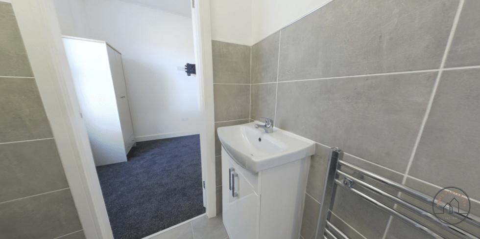 A clean, well-maintained bathroom featuring a s...