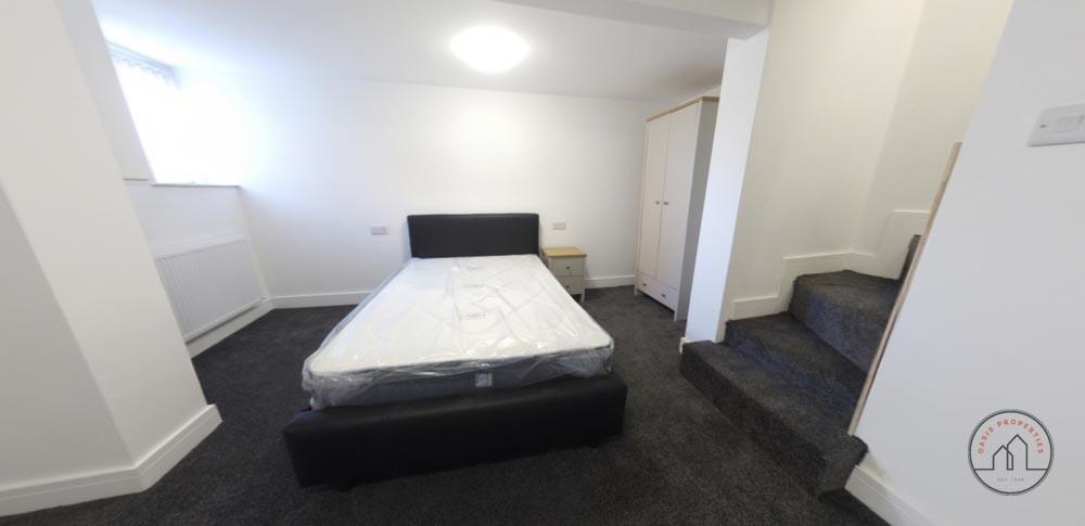 A clean and well-maintained bedroom featuring a...