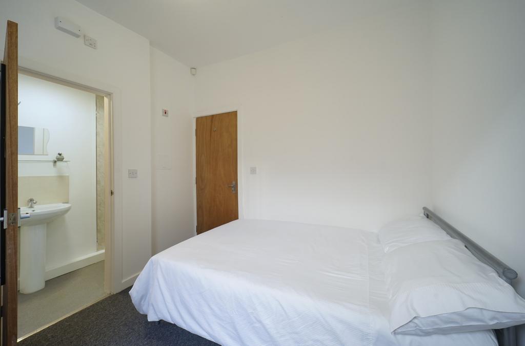 A well-maintained, tidy double bedroom featurin...
