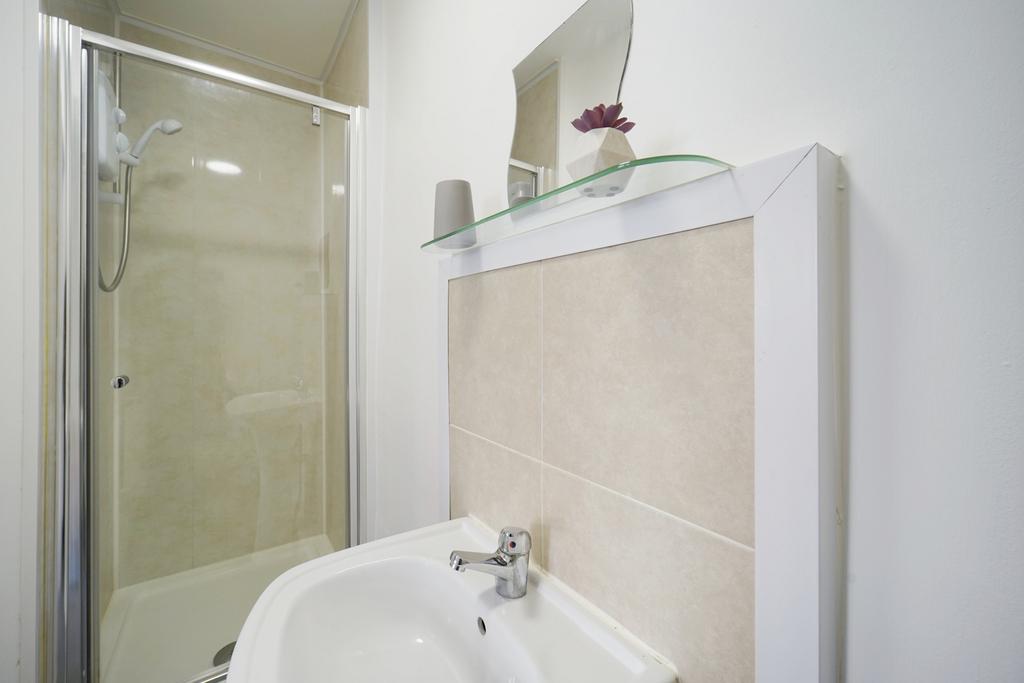 A clean and well-maintained bathroom with a lar...