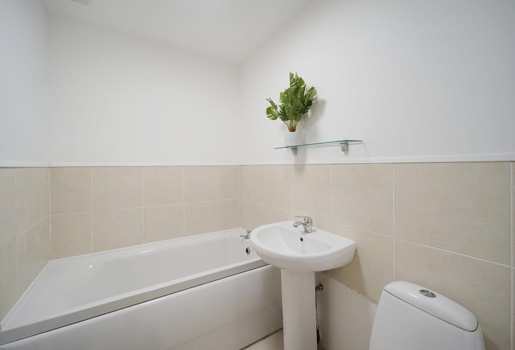 A clean and well-maintained bathroom featuring ...