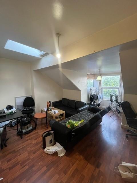 Bright and modern living room featuring ample n...