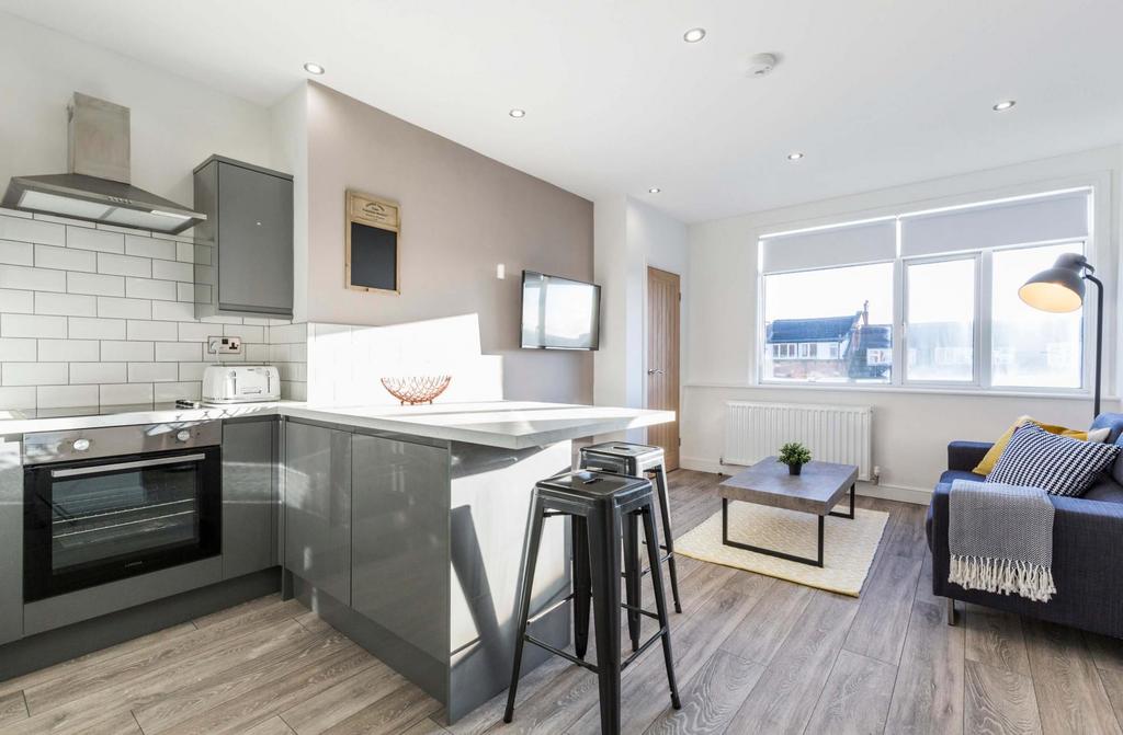 A bright, modern living room with ample natural...