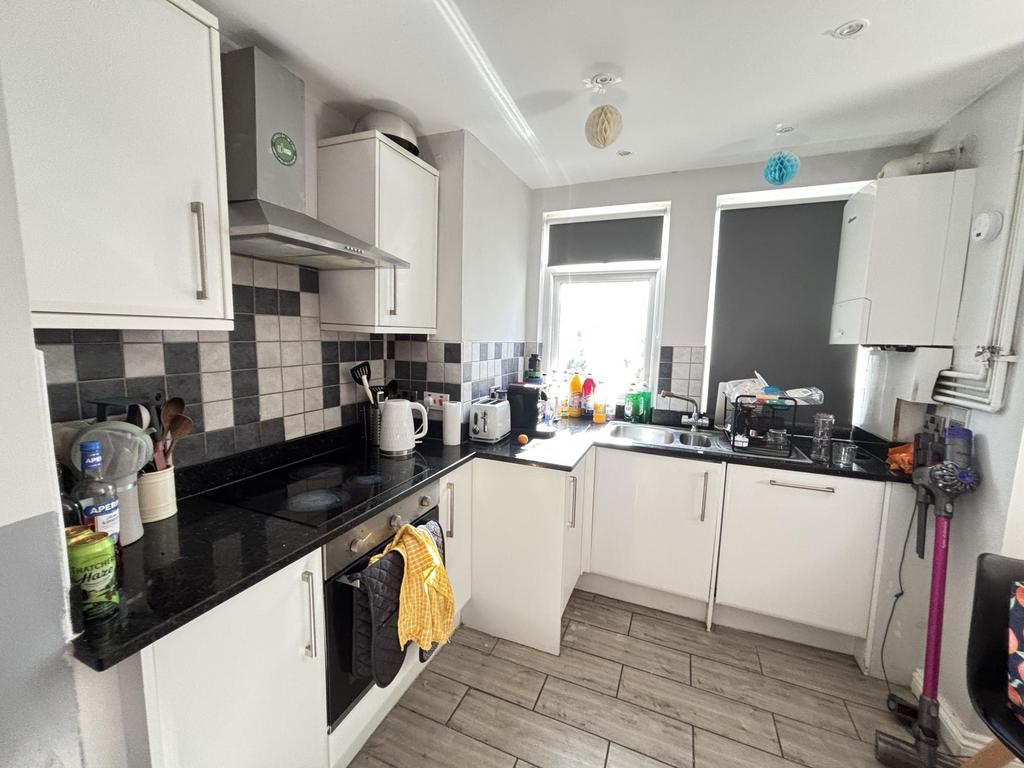 Bright and well-maintained kitchen featuring am...
