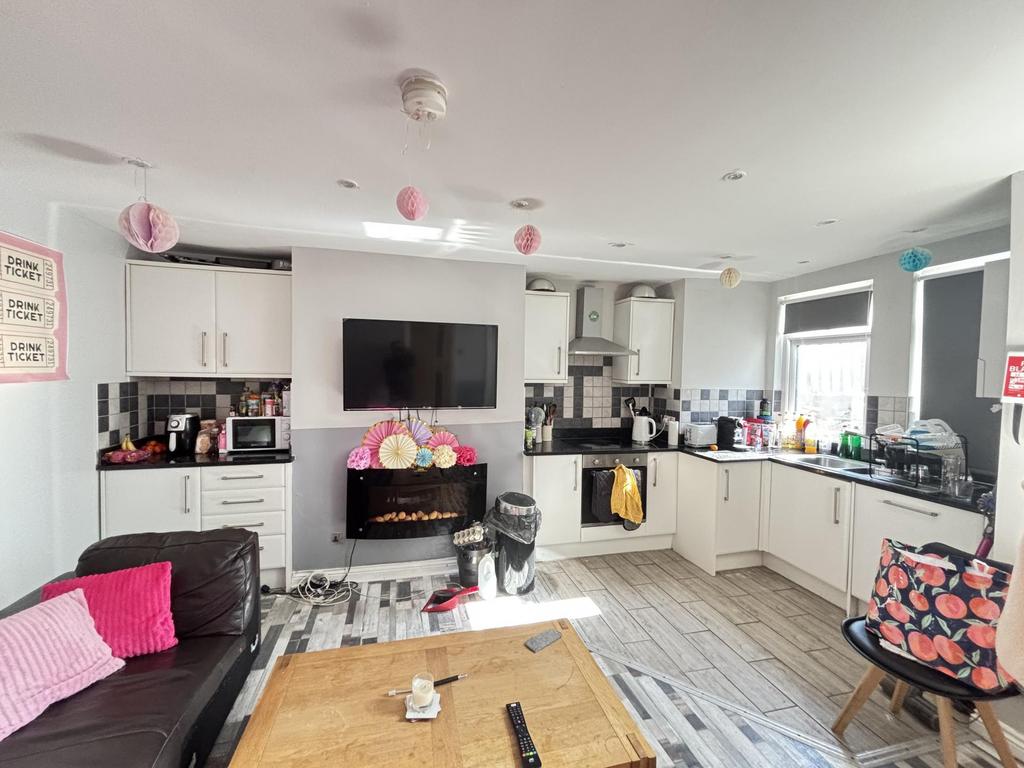 Bright and modern living room featuring ample n...
