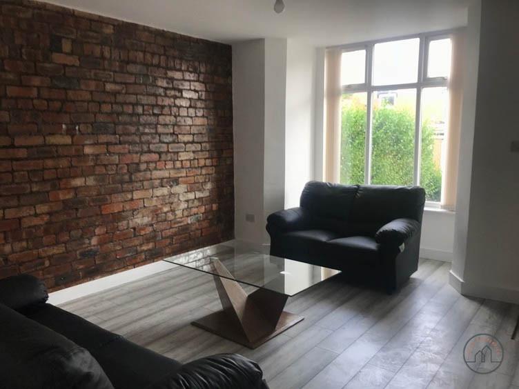 A bright and neatly maintained living room feat...