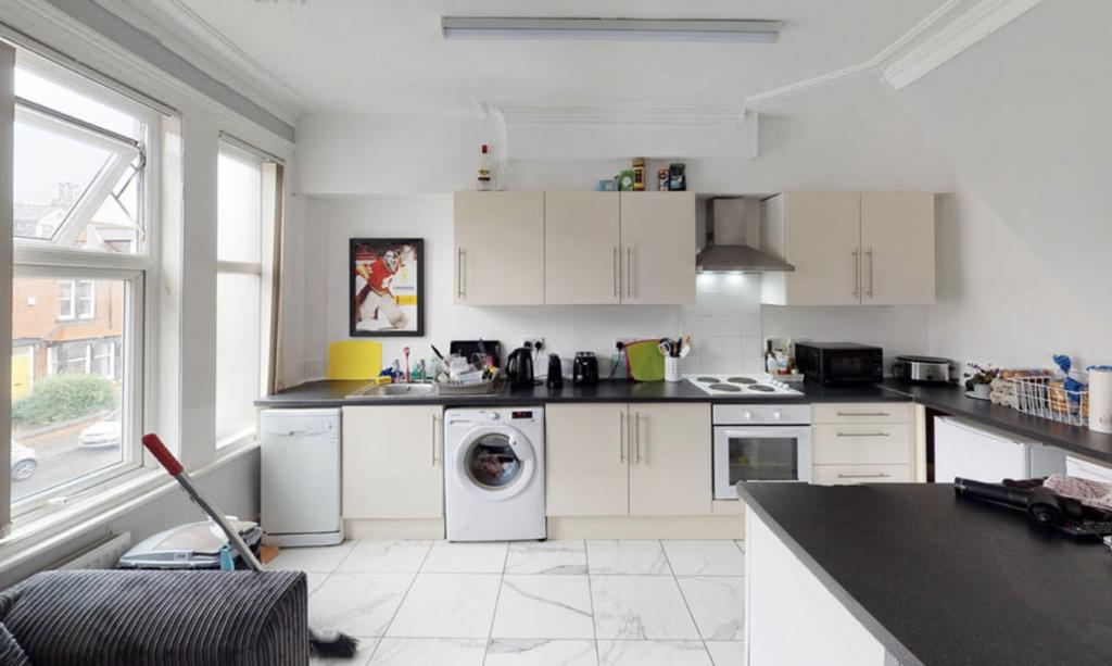 Modern kitchen with ample natural light, clean ...