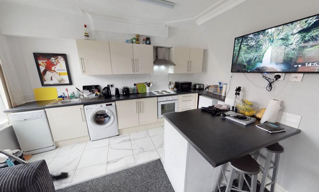 Bright and modern kitchen featuring ample works...