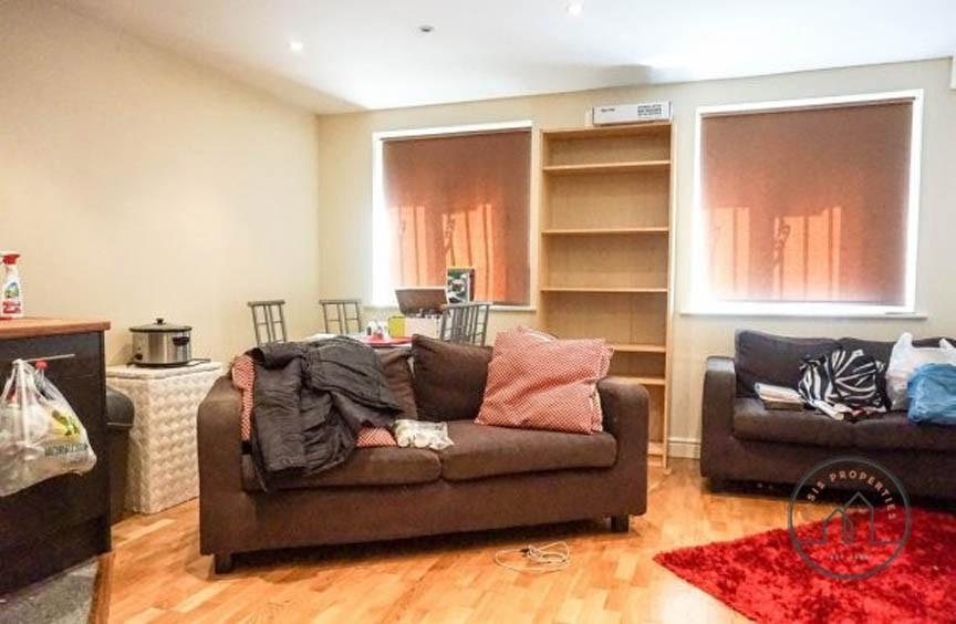 A spacious and inviting living room featuring t...