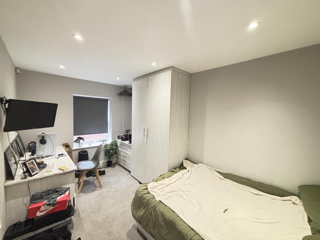 A spacious and well-maintained master bedroom f...