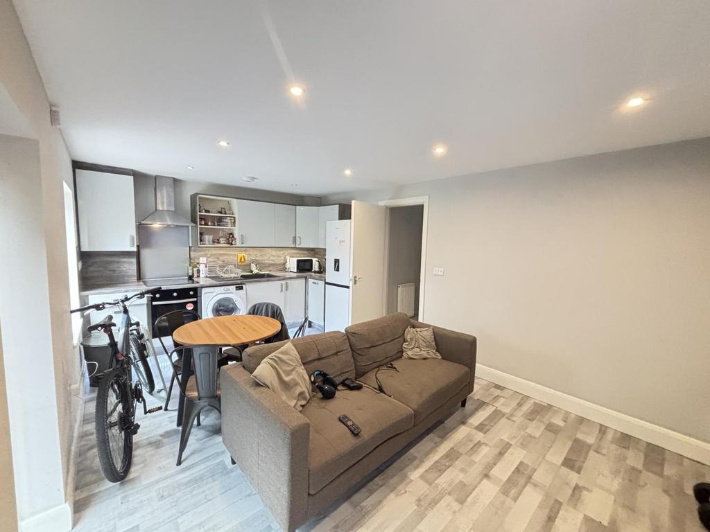 A bright and modern living room featuring a com...