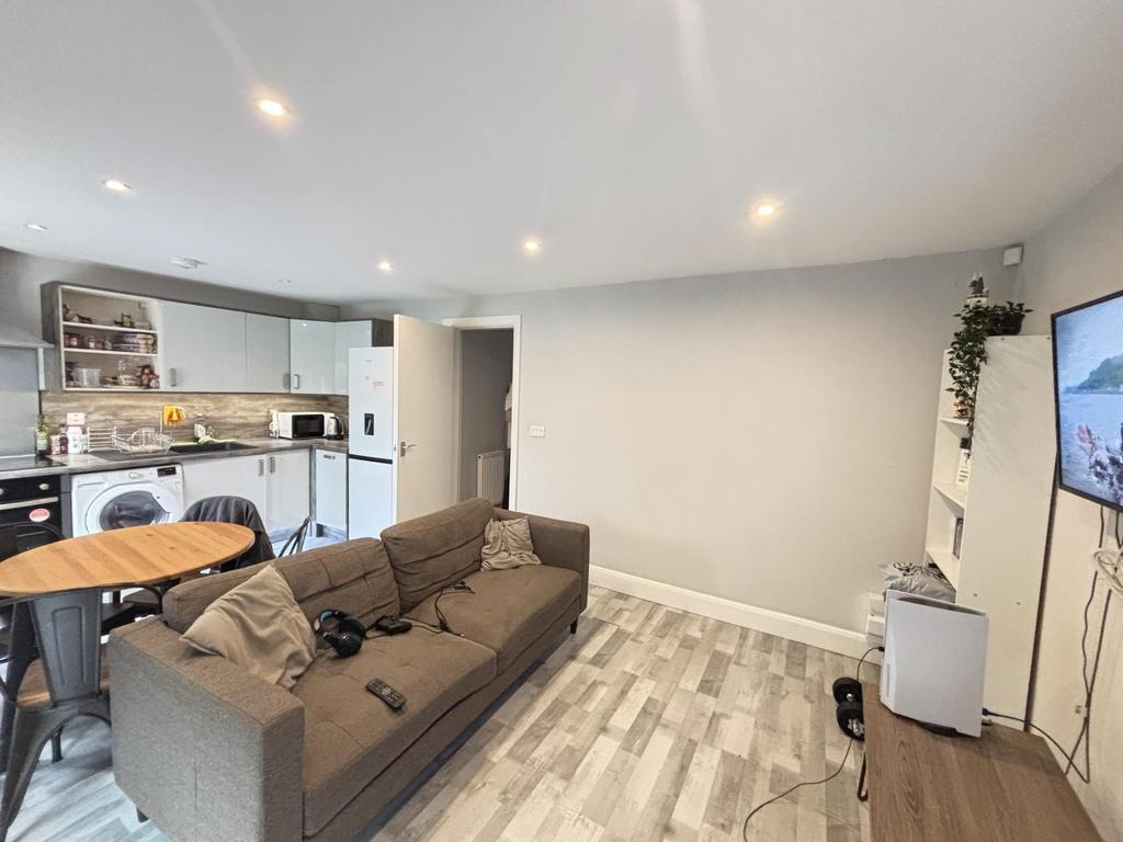 A spacious and modern living room with ample na...
