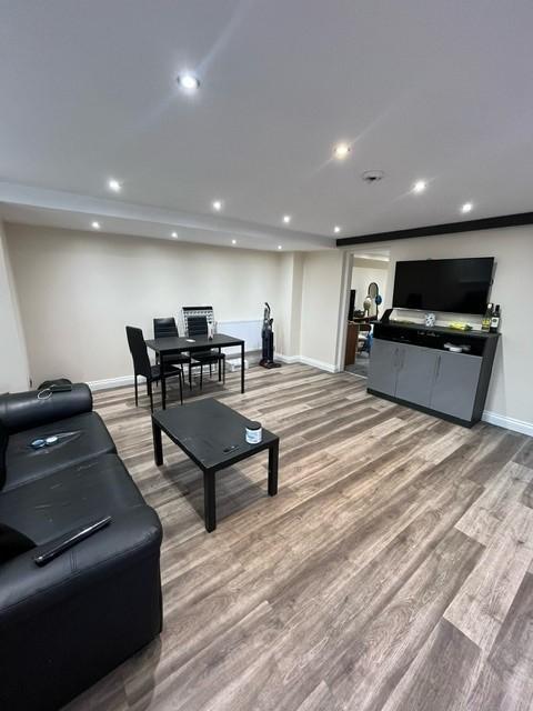 Modern and spacious living room featuring a lar...