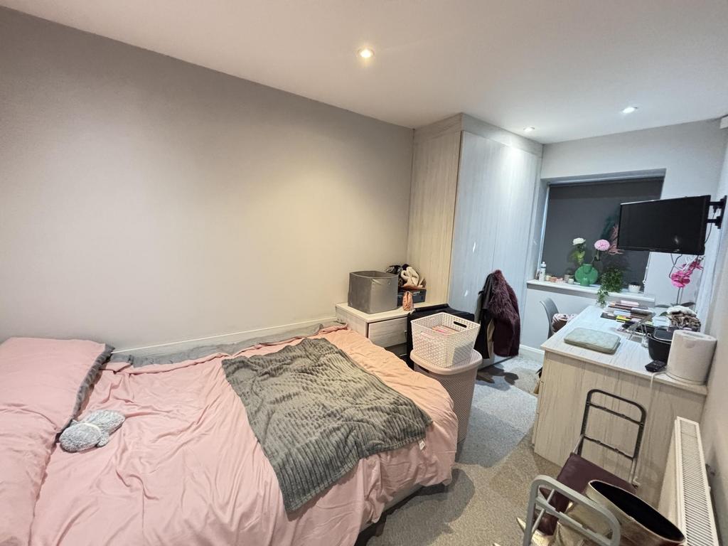 A spacious and well-maintained master bedroom f...