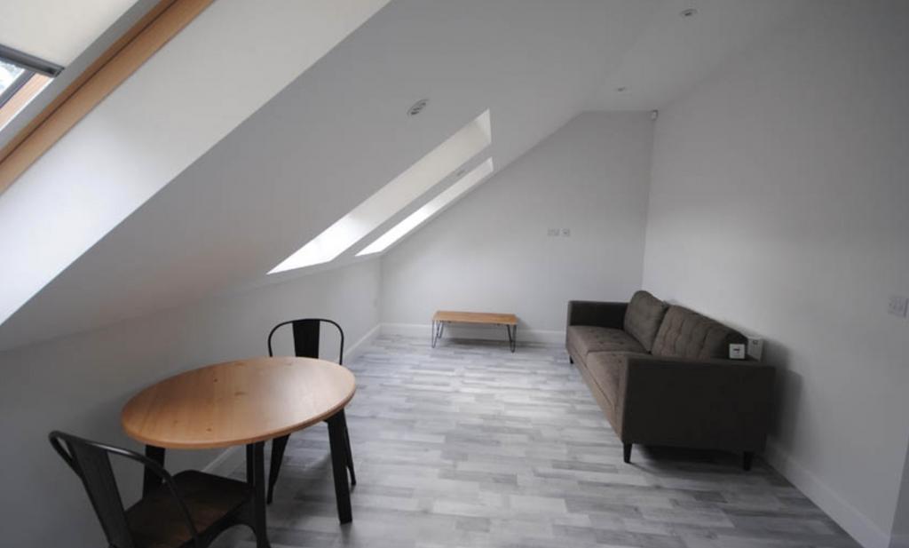 A bright and modern living room featuring a com...